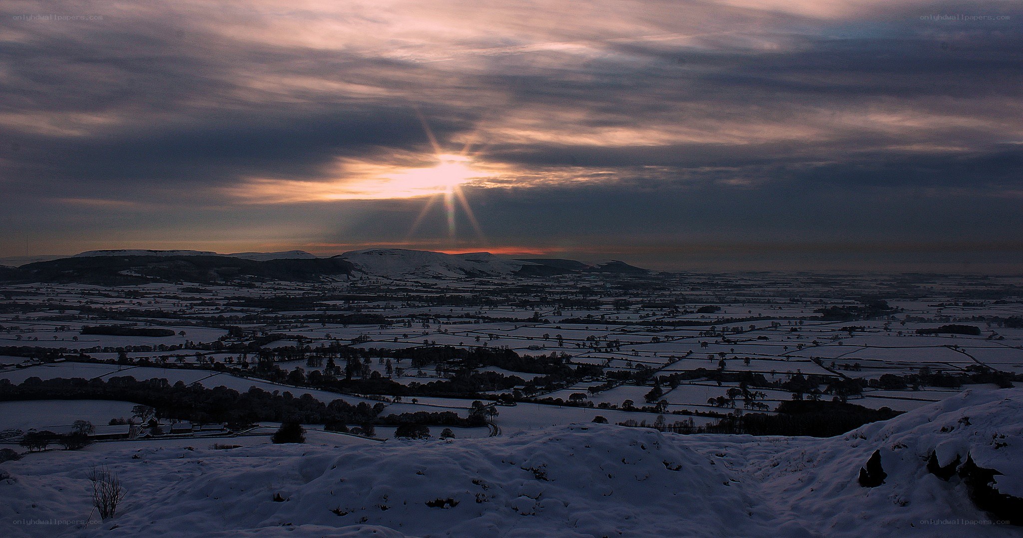 Snowy landscape at sunset