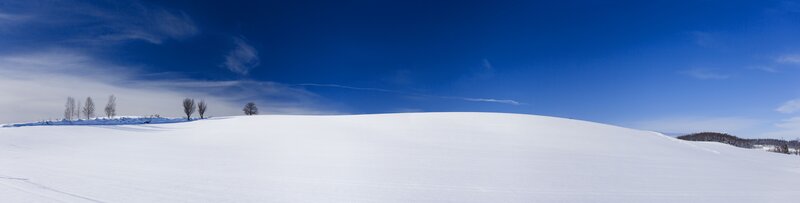 Snowy landscape under blue sky