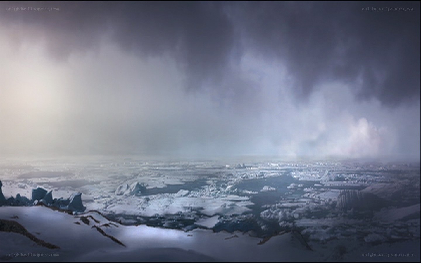 snowy landscape under stormy sky