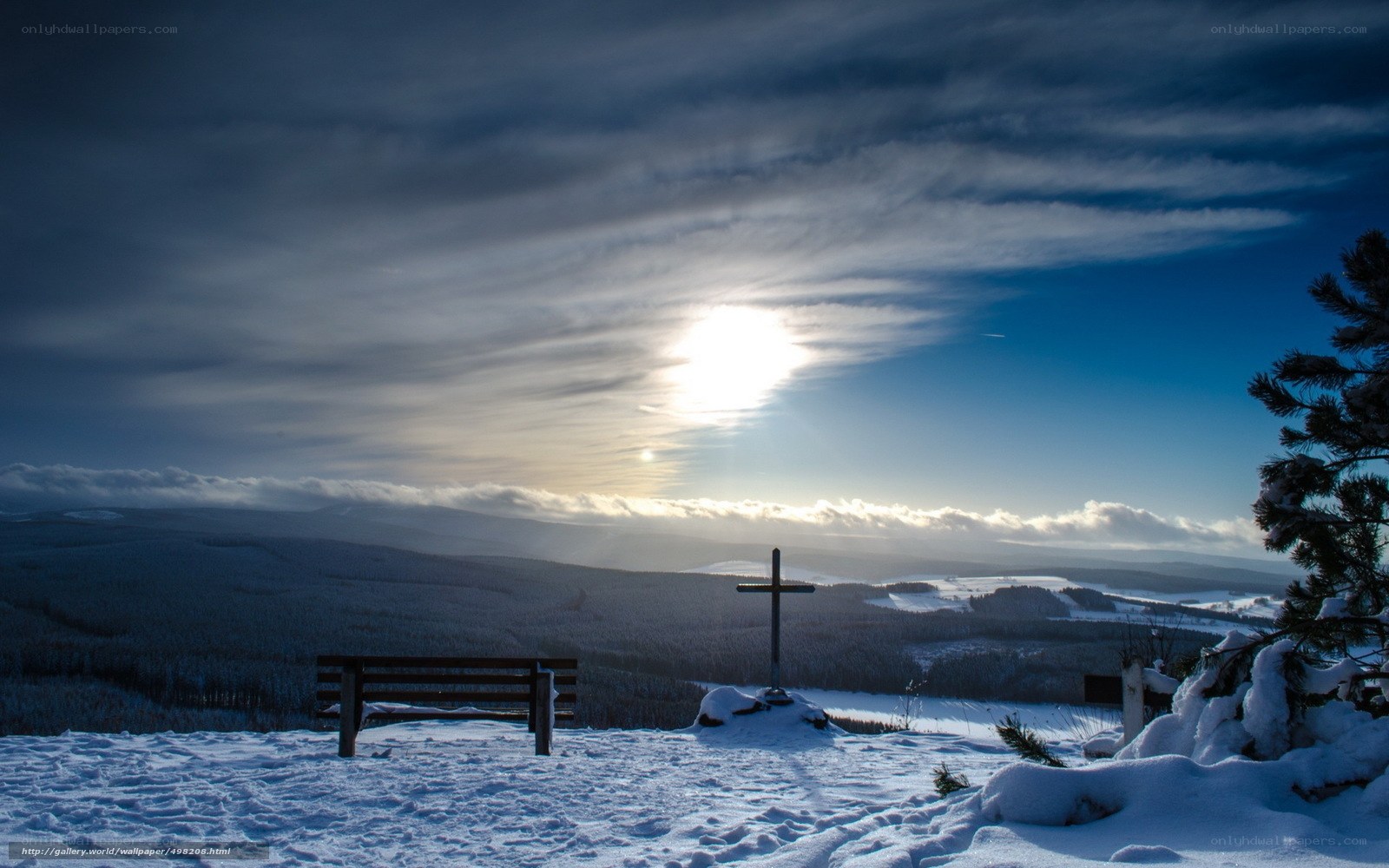 Snowy landscape with cross