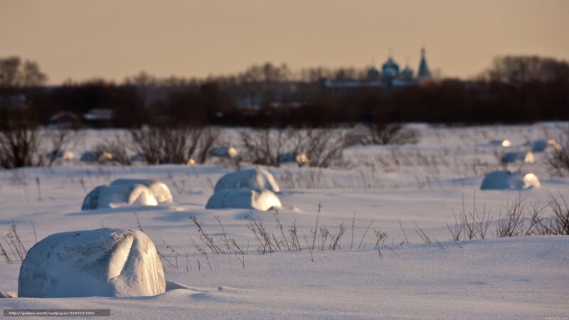 Snowy landscape with distant church