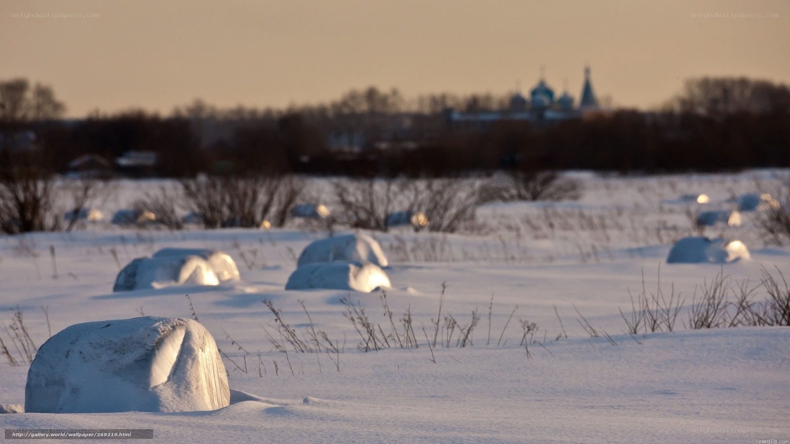 Snowy landscape with distant church