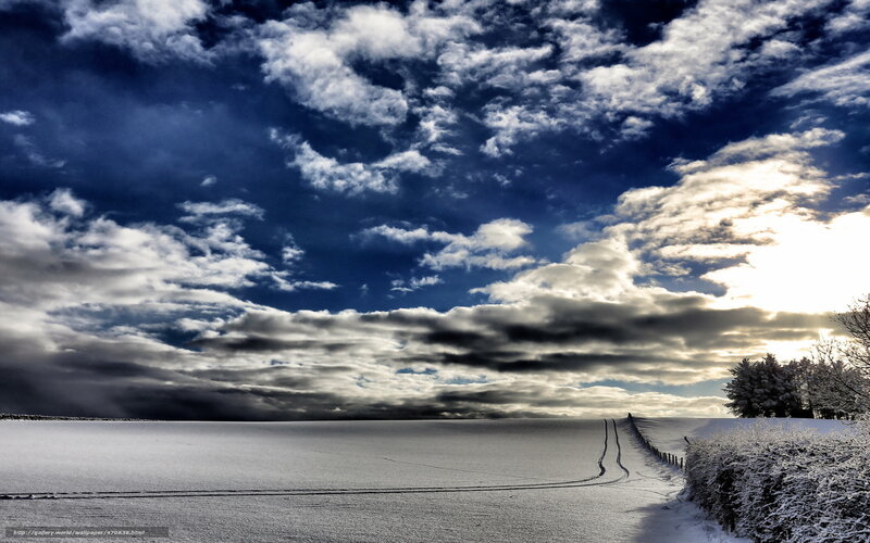 Snowy landscape with dramatic sky