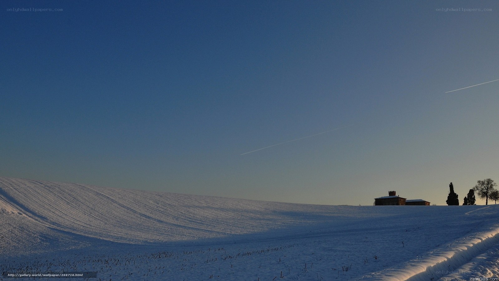 Snowy landscape with farmhouse