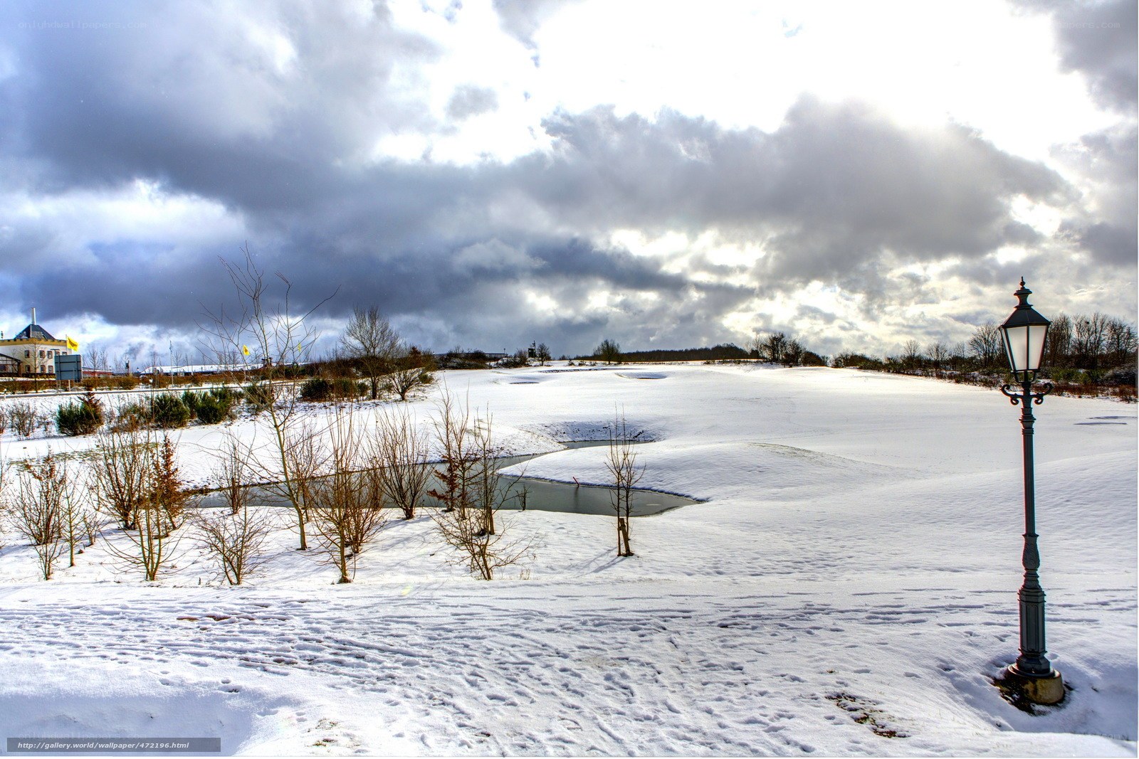 Snowy landscape with lamp post