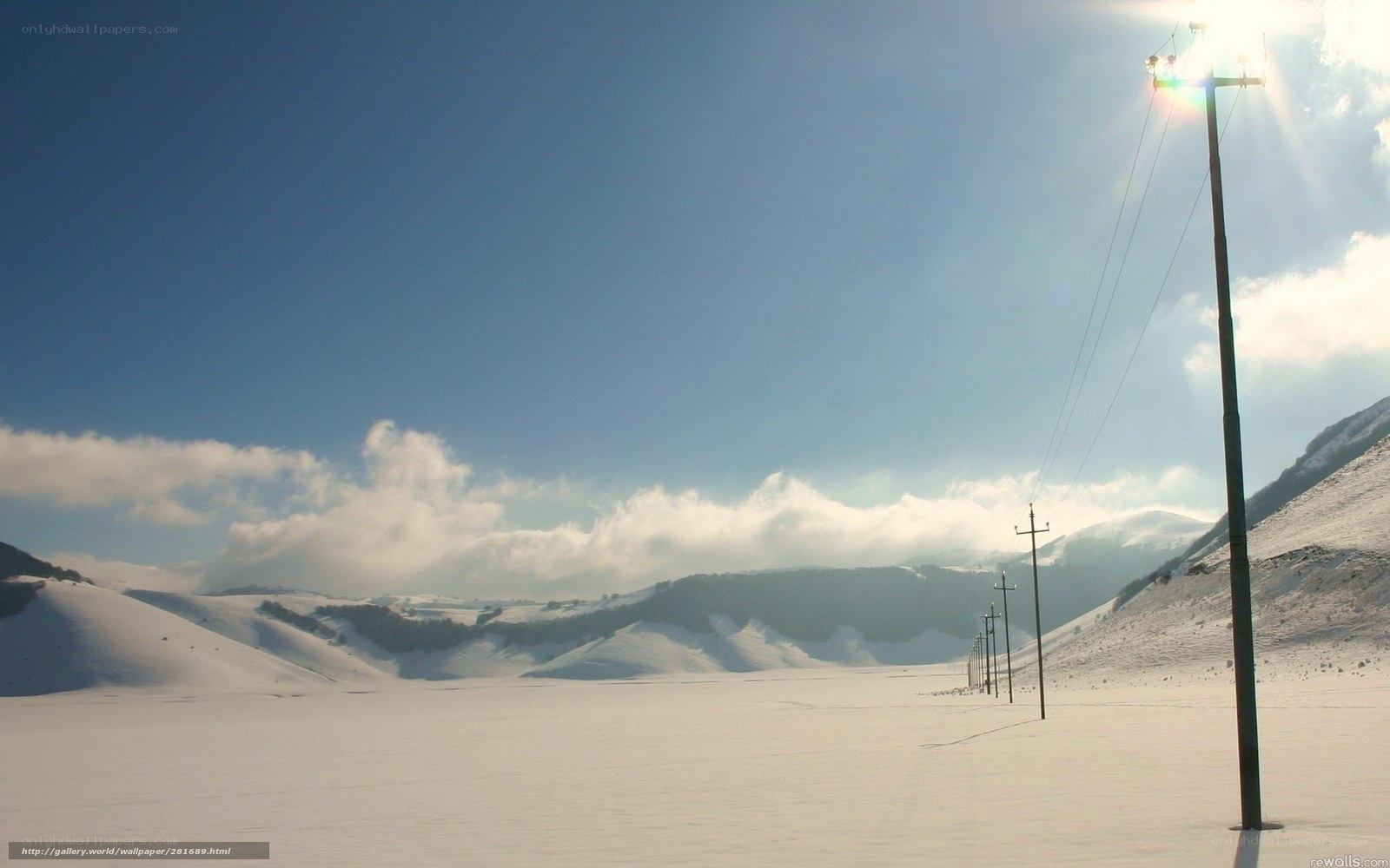 Snowy landscape with power lines