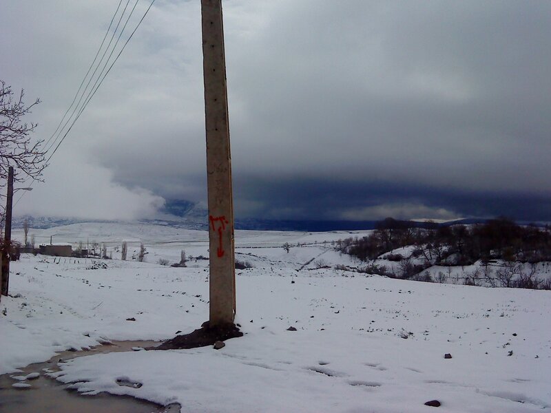 Snowy landscape with power pole