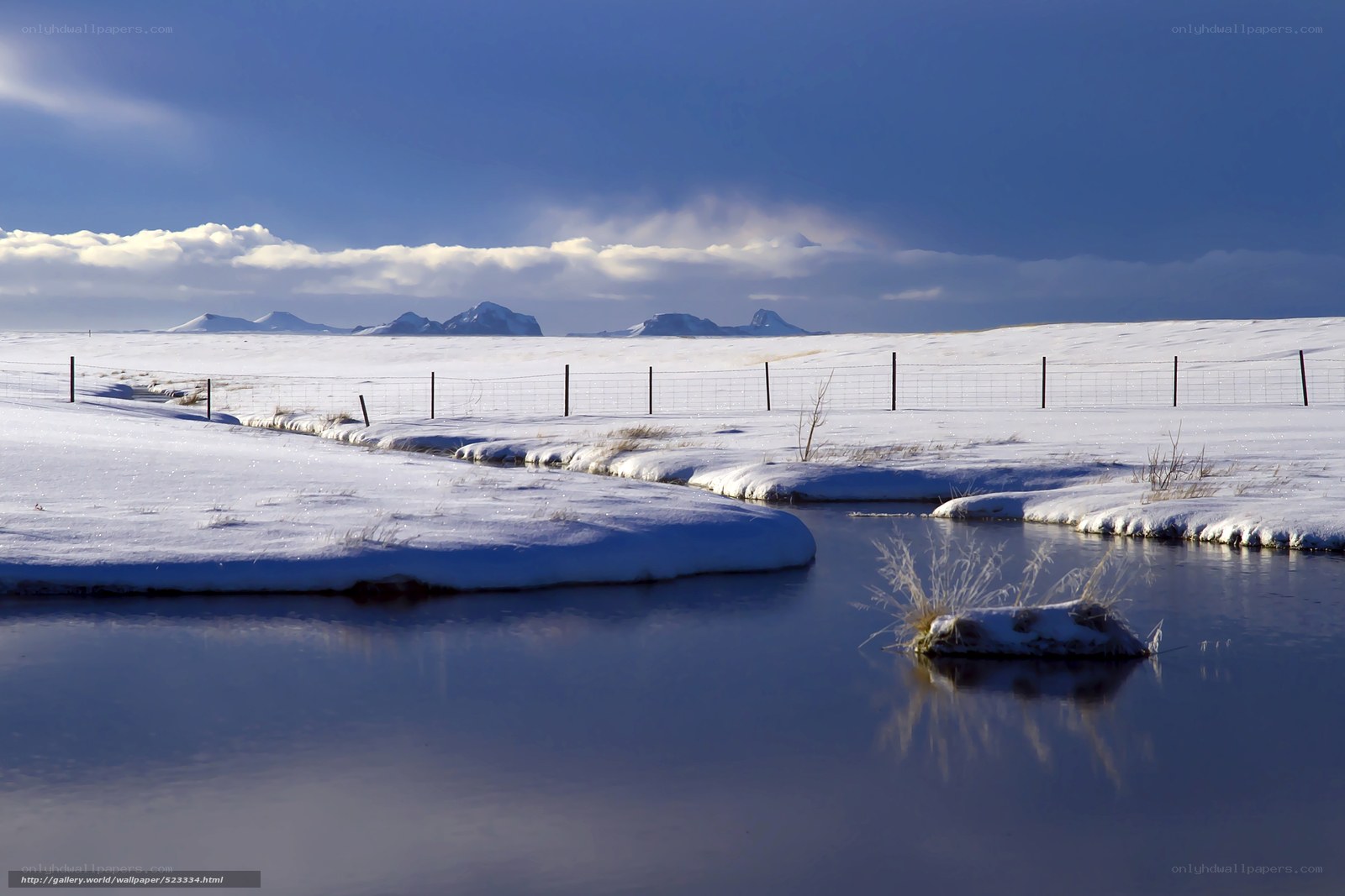 Snowy landscape with river and mountains