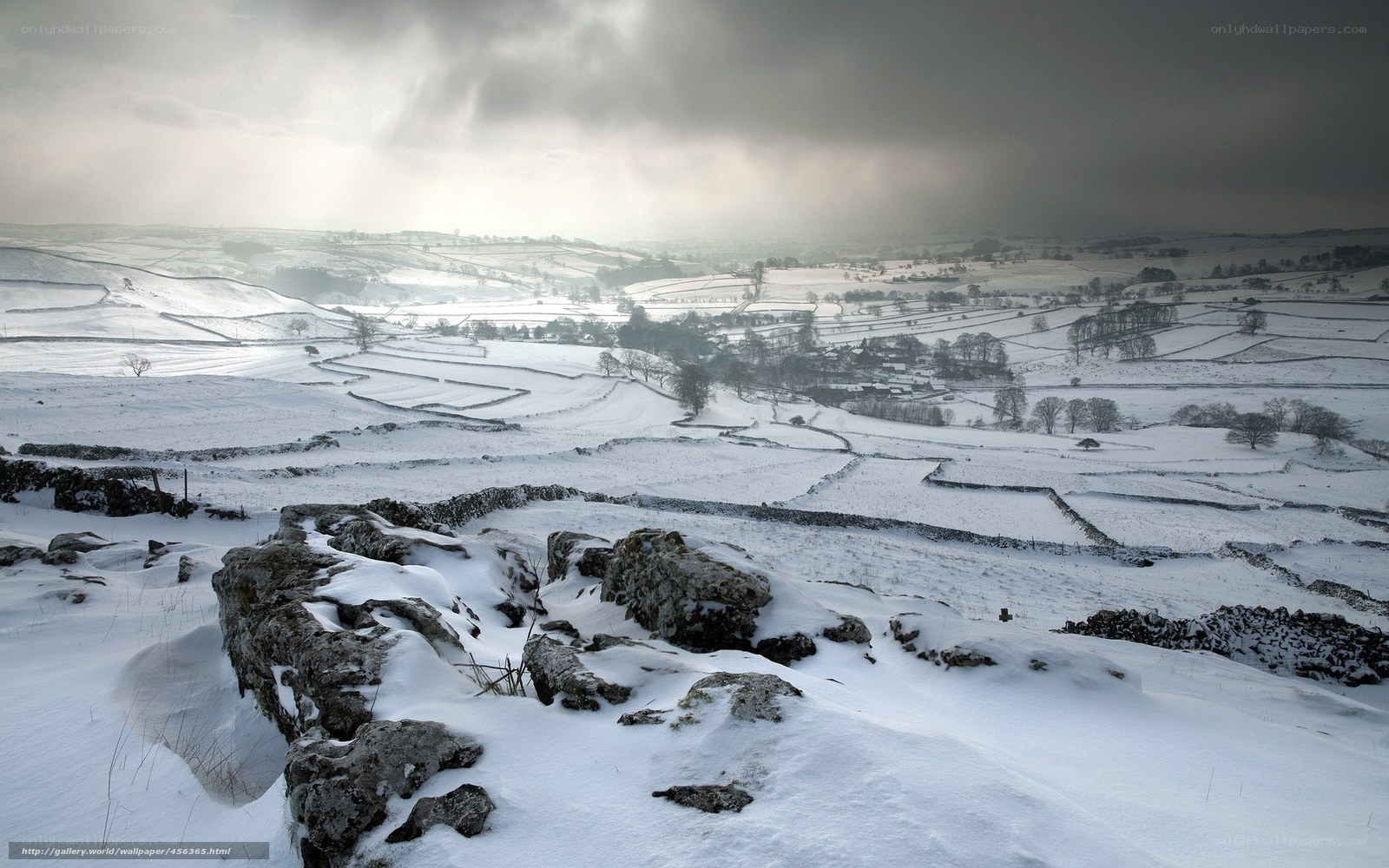Snowy landscape with stone walls