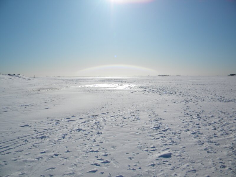 snowy landscape with sun halo