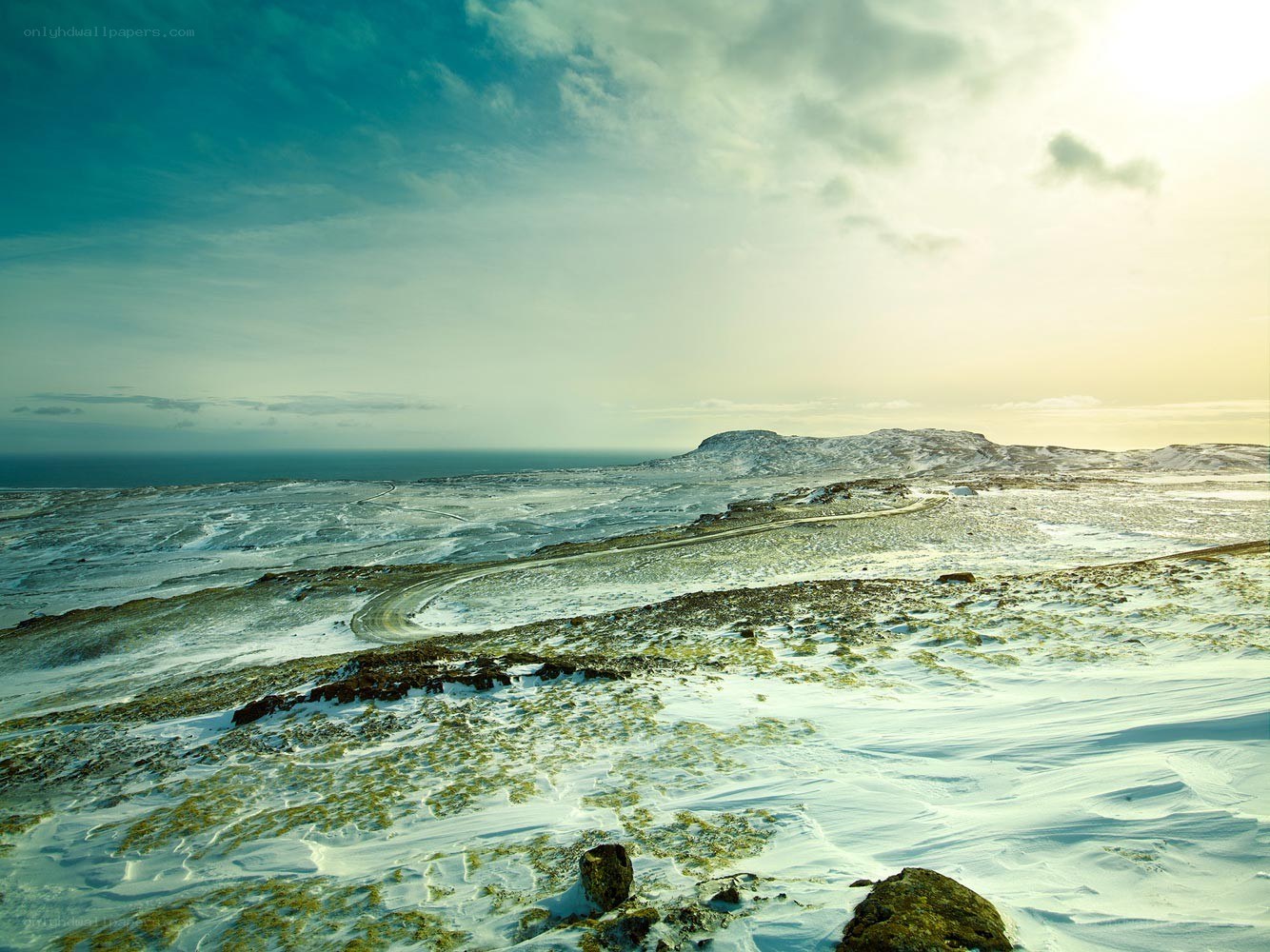 Snowy landscape with winding road