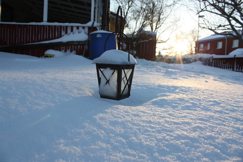 Snowy lantern at sunset
