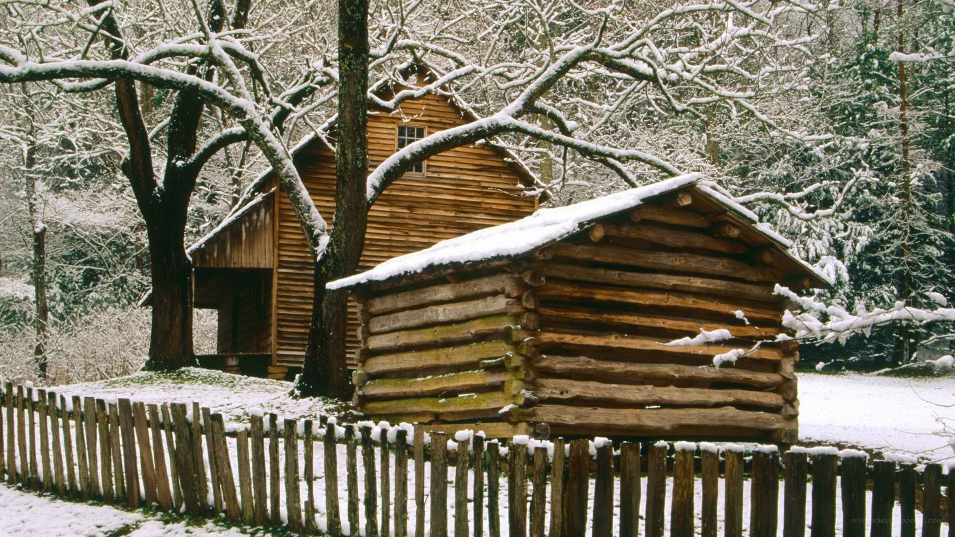 Snowy log cabin in winter