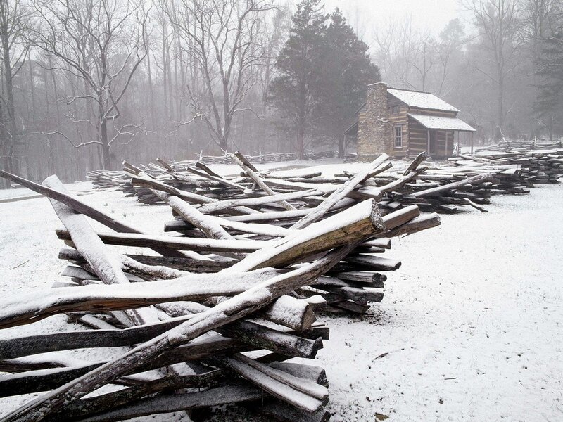 Snowy log cabin in winter