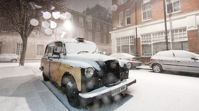 Snowy London taxi scene