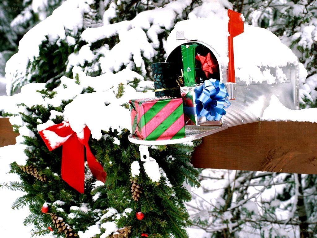 Snowy mailbox with gifts