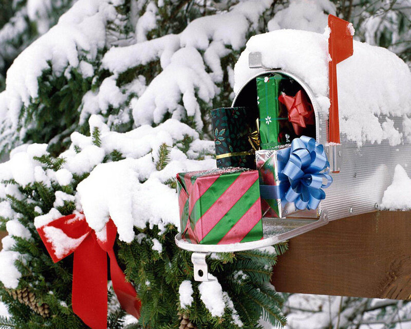 Snowy mailbox with gifts
