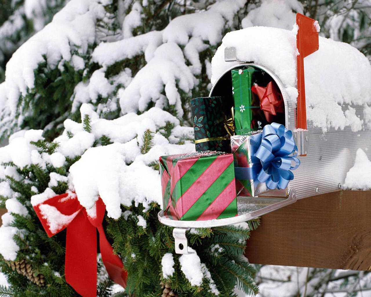 Snowy mailbox with gifts
