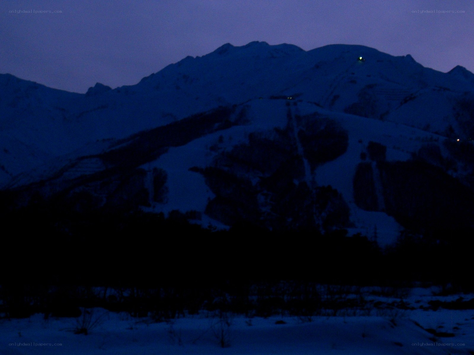 snowy mountain at dusk
