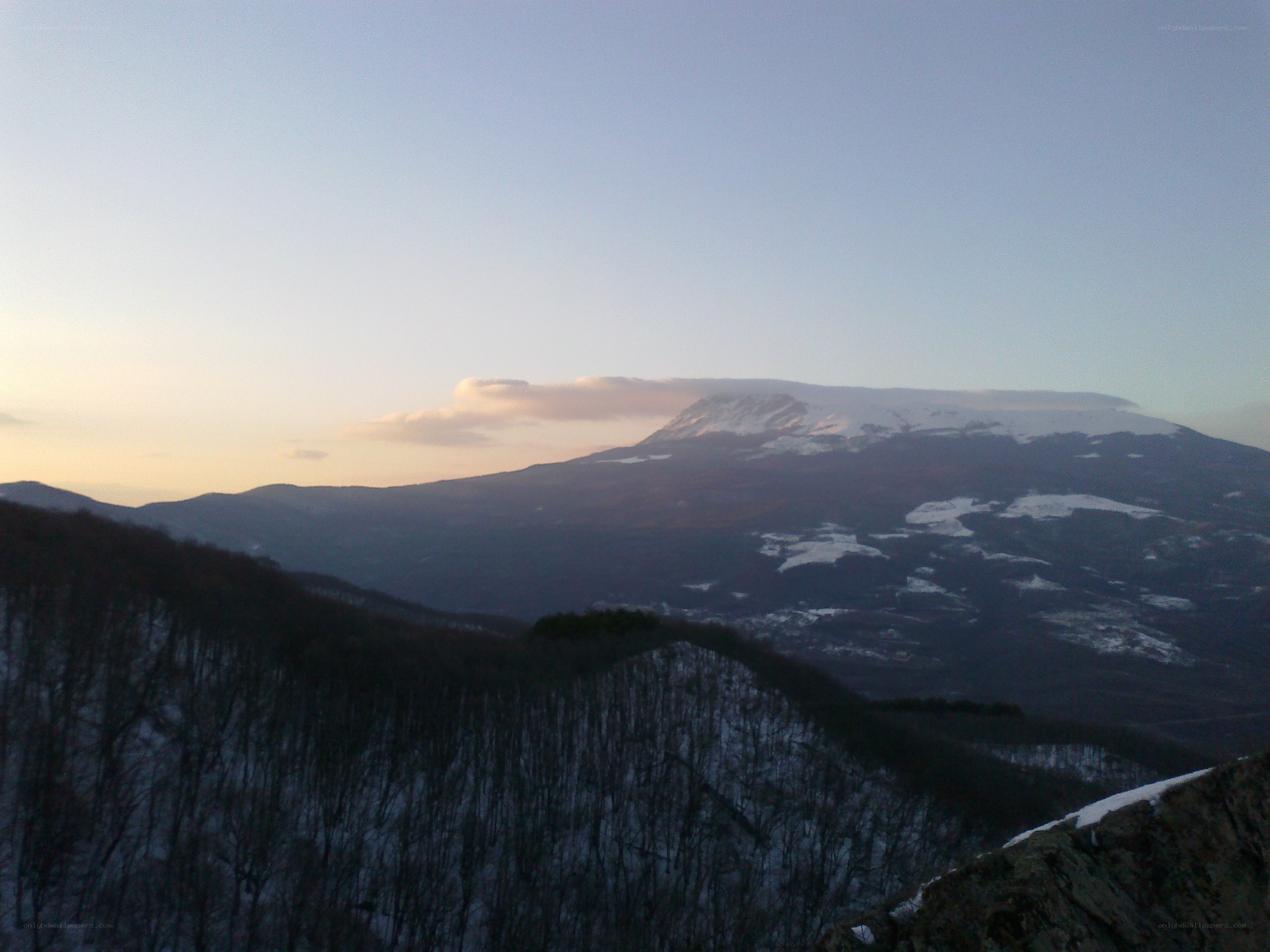 snowy mountain at dusk