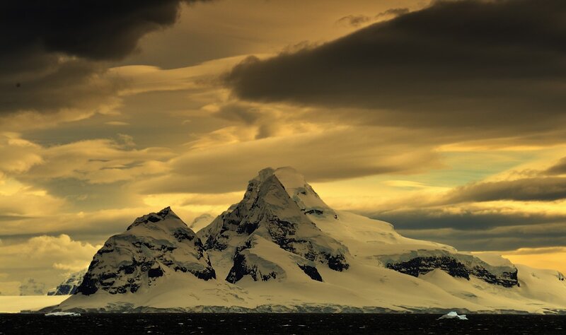 Snowy mountain at golden hour