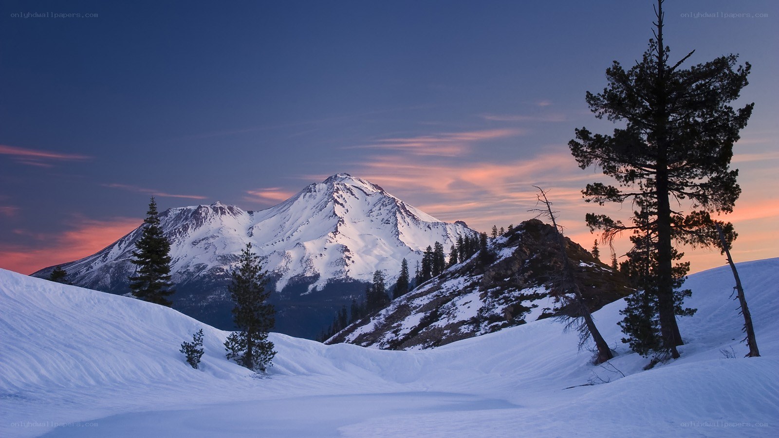 Snowy mountain at sunset