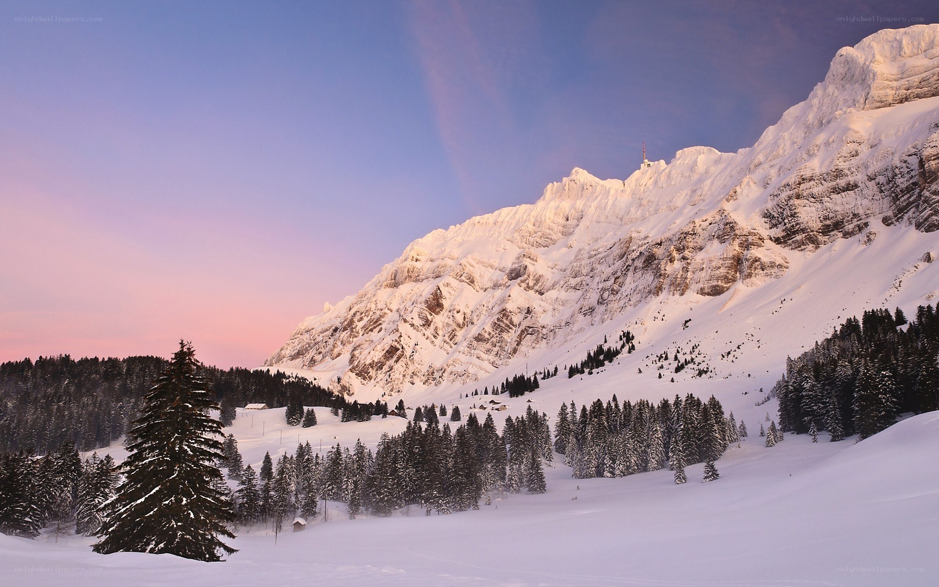 Snowy mountain at sunset