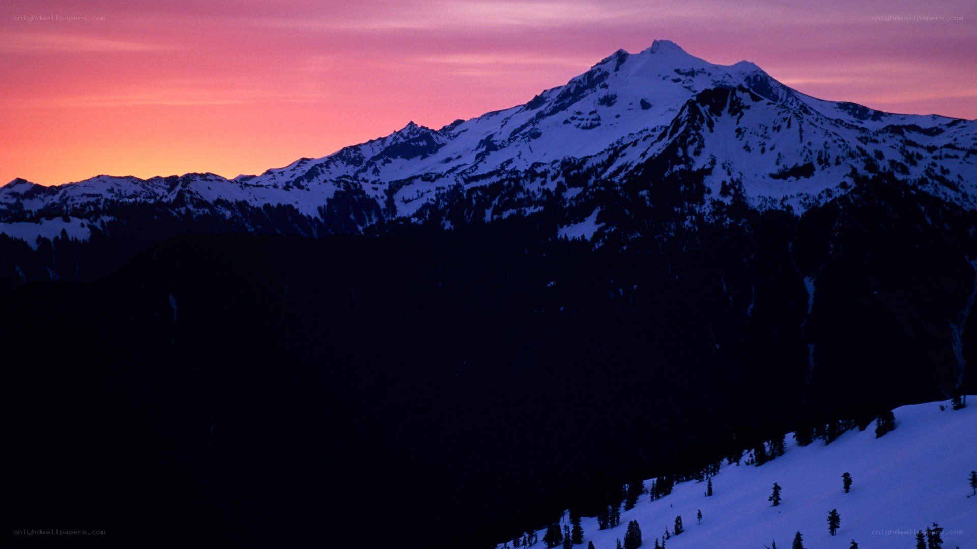 snowy mountain at sunset