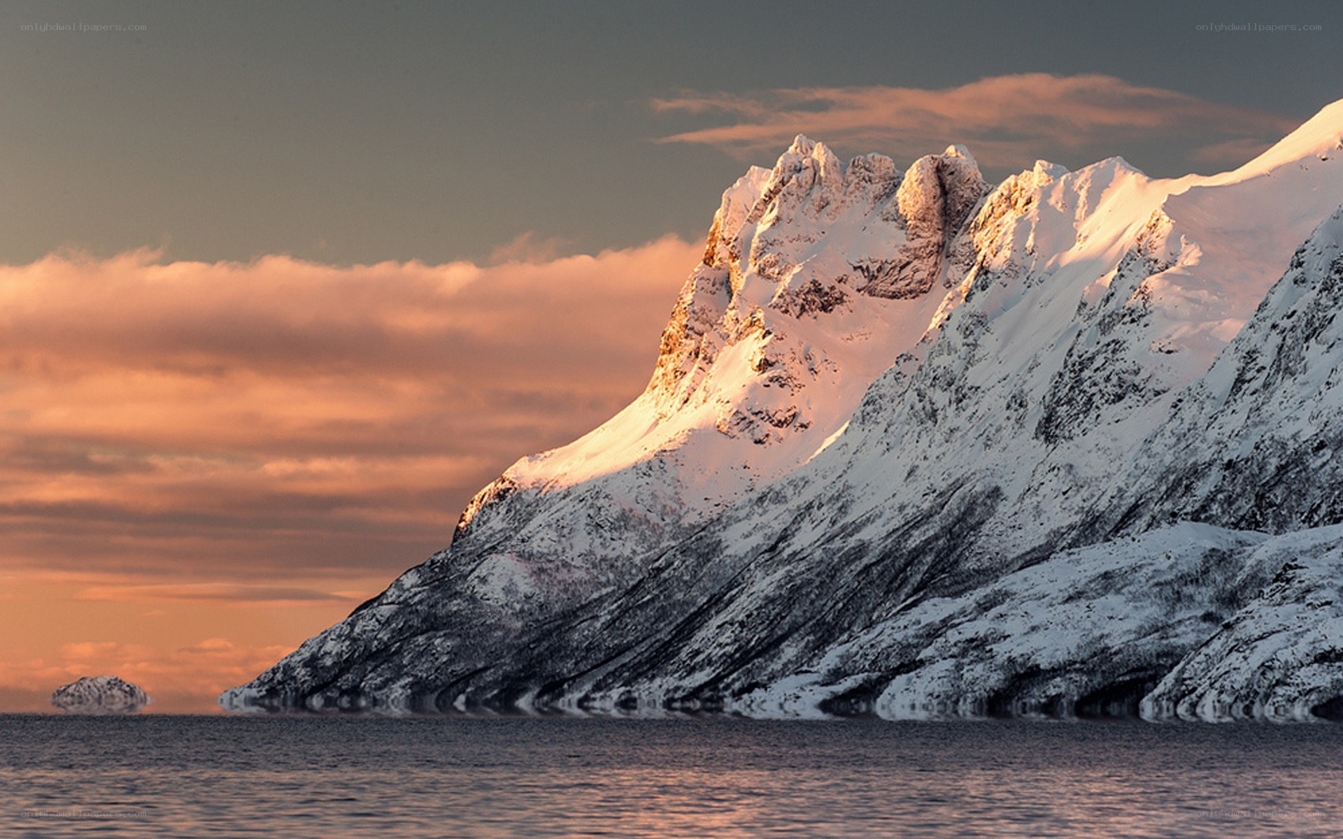 Snowy mountain at sunset