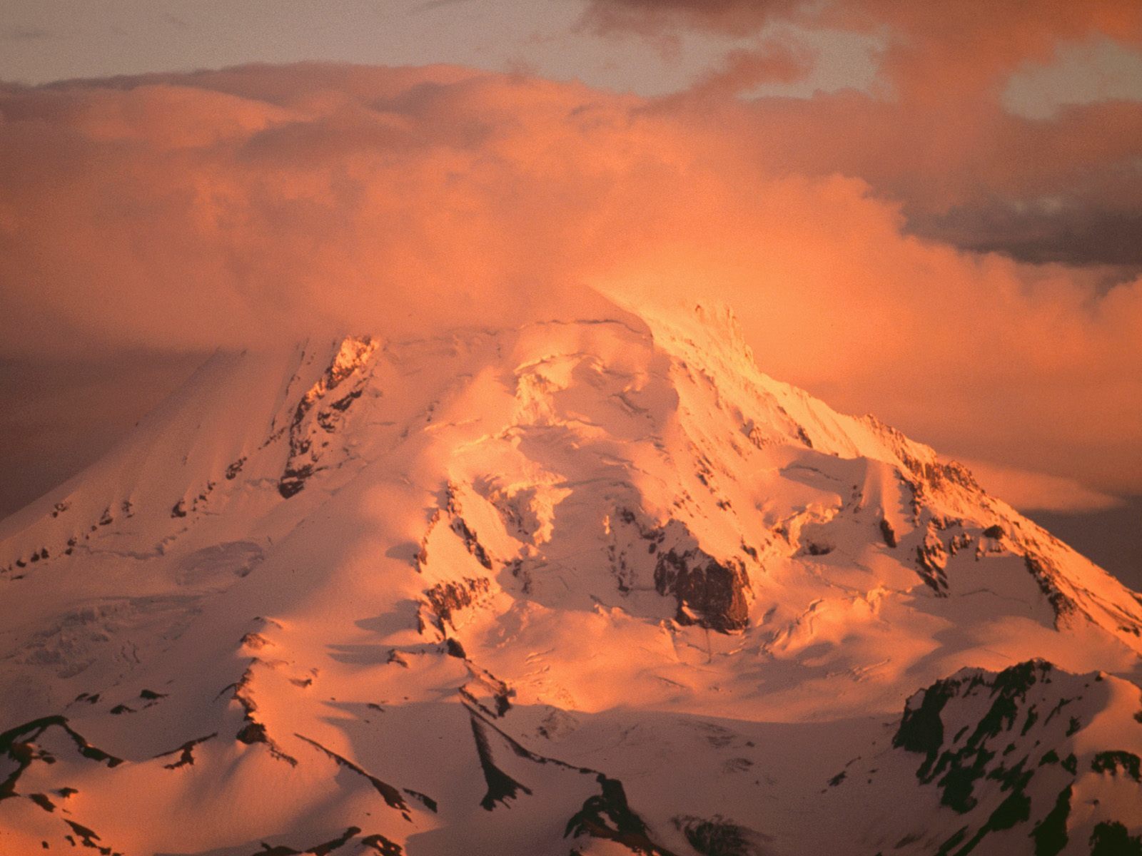 Snowy mountain at sunset