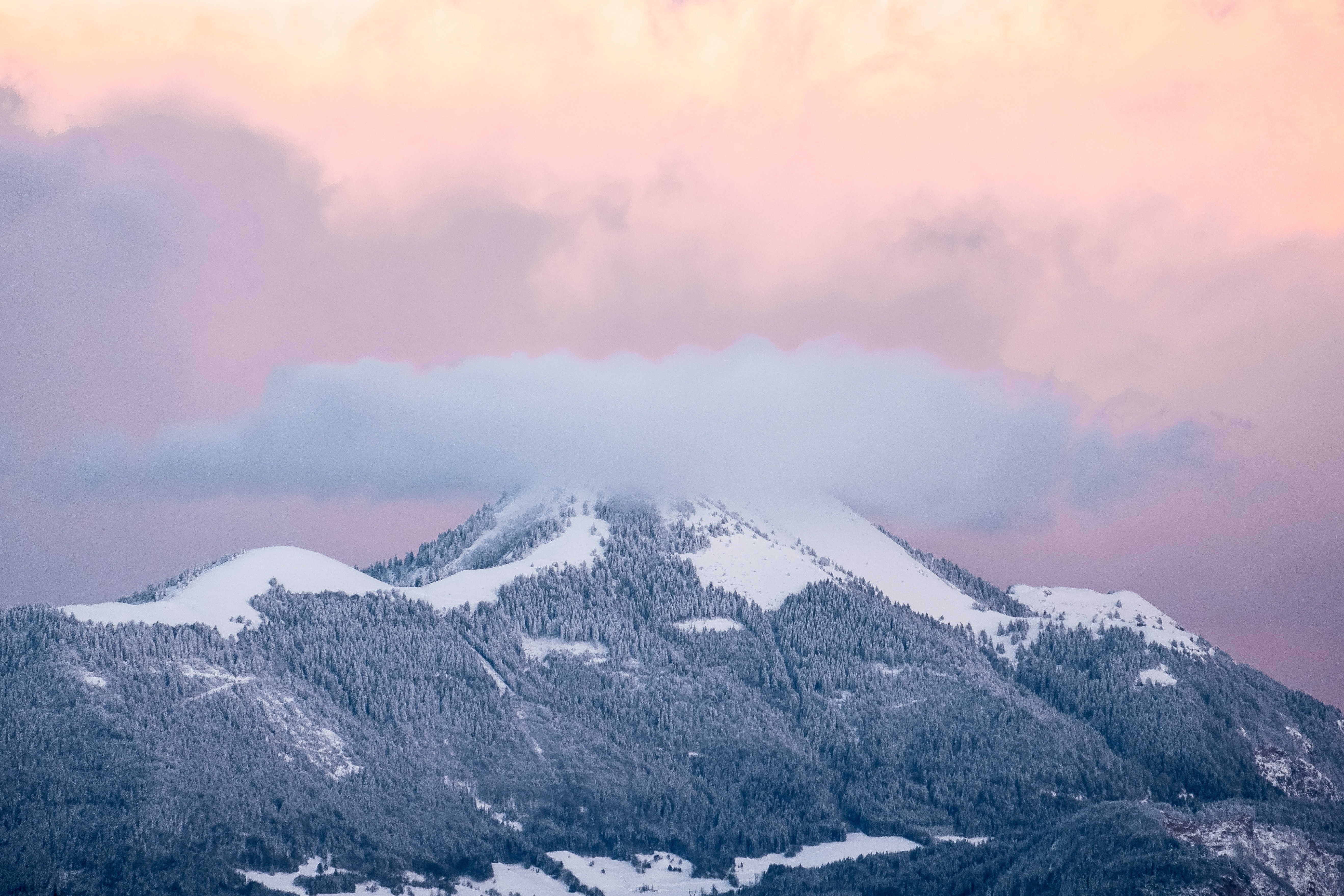 Snowy mountain at sunset