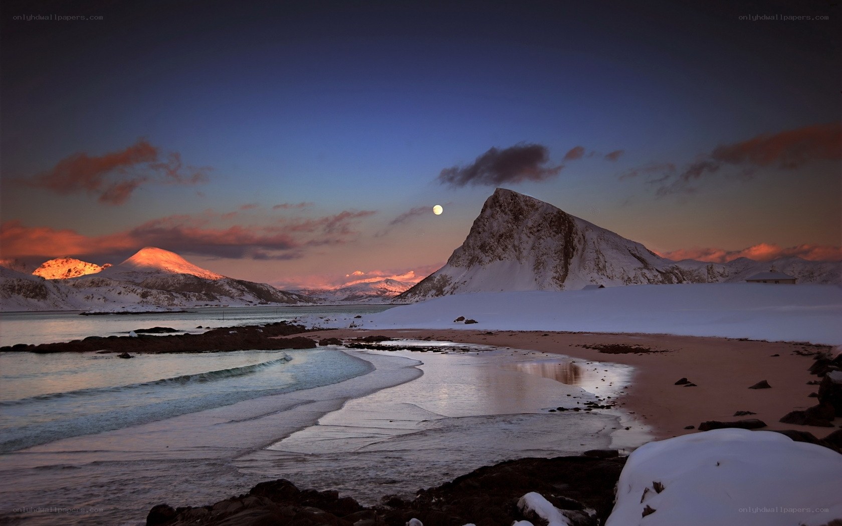 Snowy mountain beach at dusk