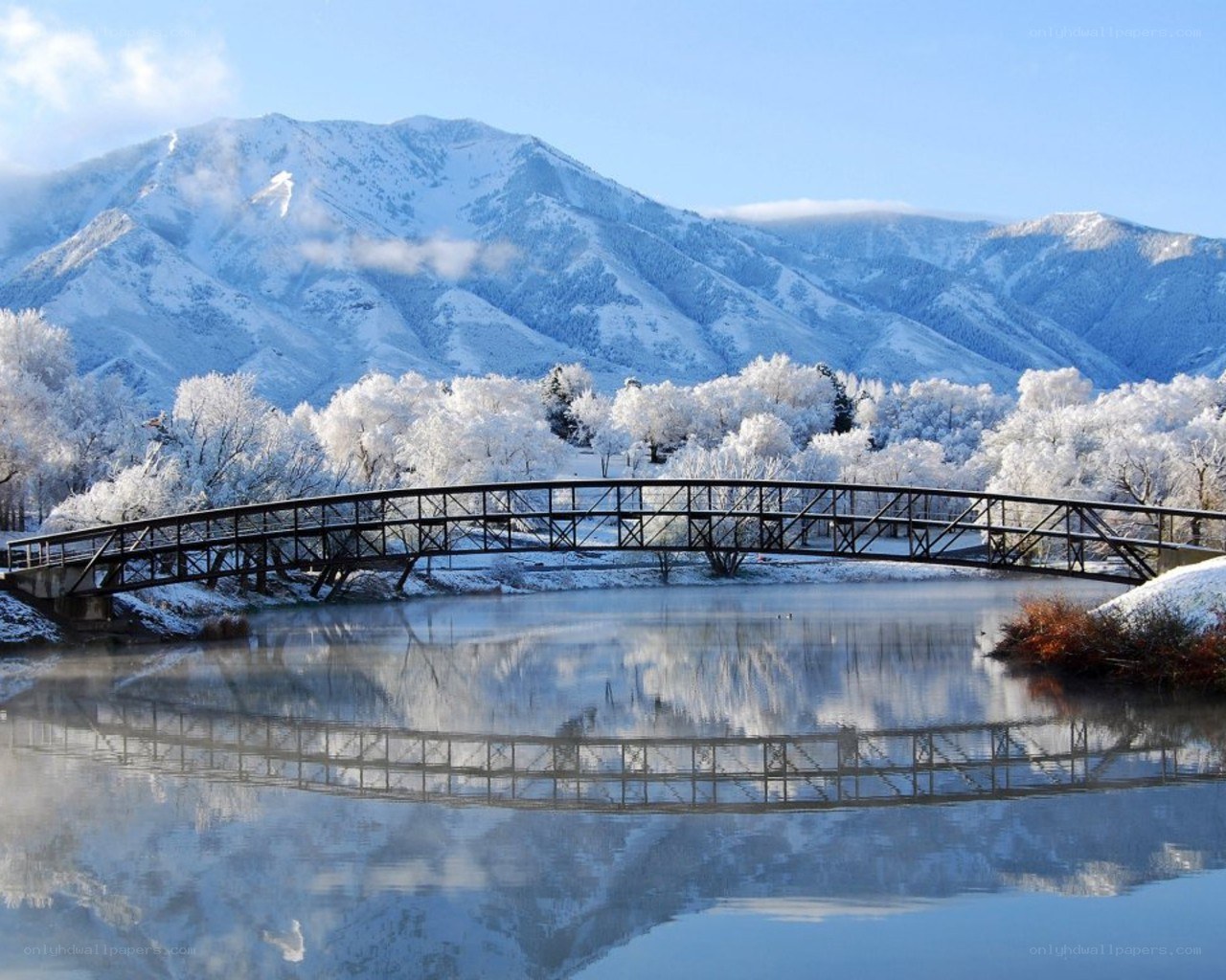 Snowy mountain bridge reflection