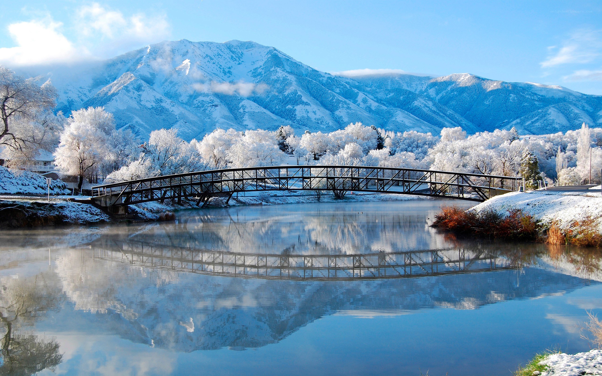 Snowy mountain bridge reflection