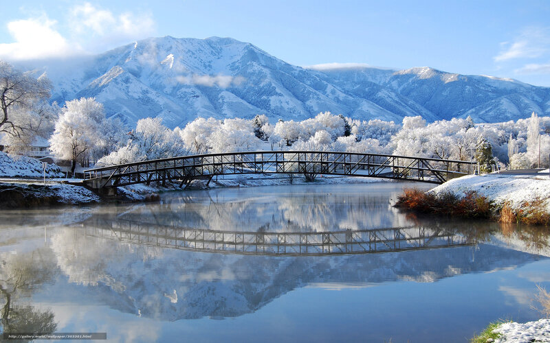 Snowy mountain bridge reflection