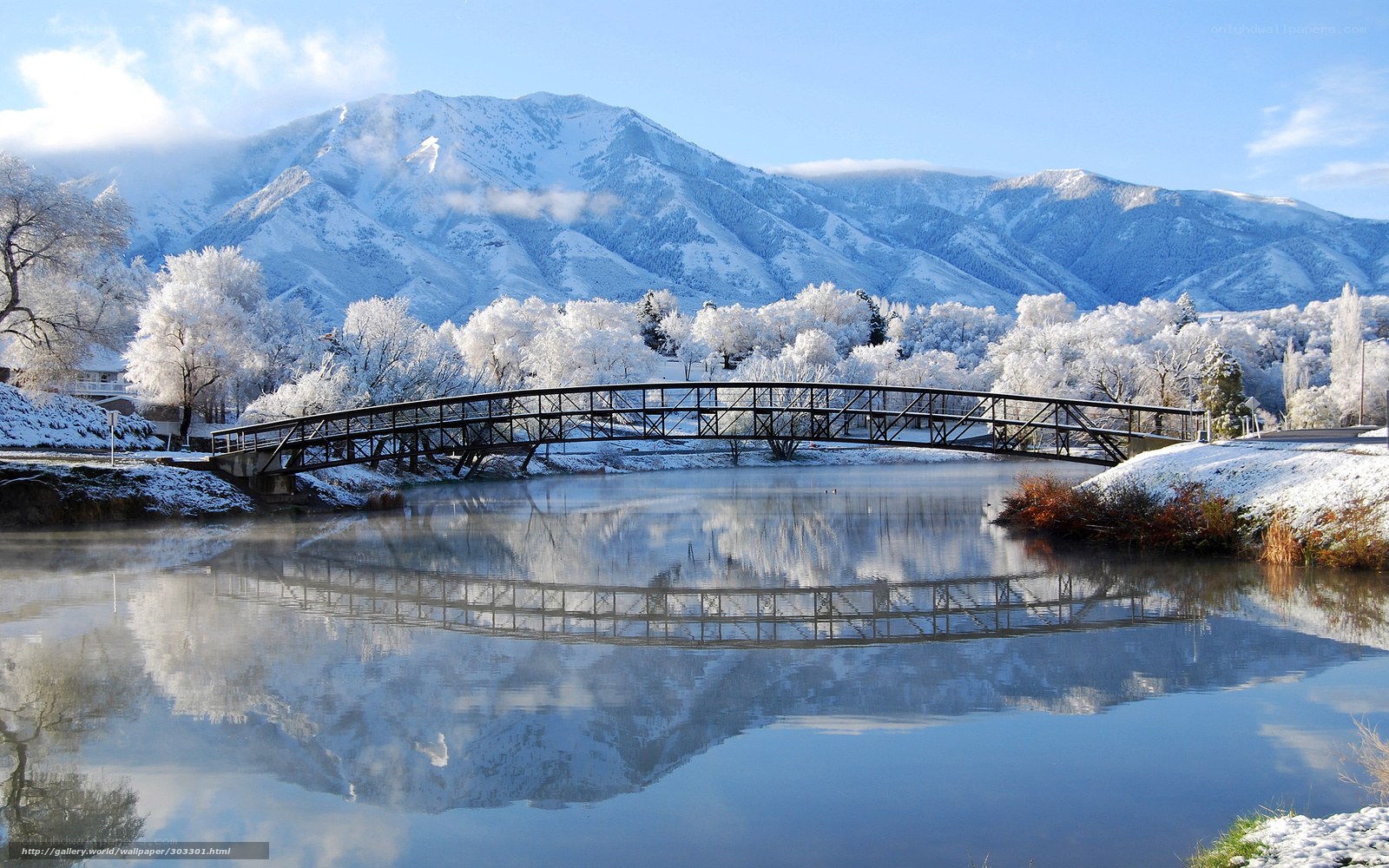 Snowy mountain bridge reflection