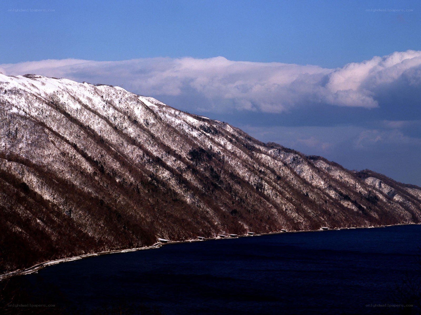 Snowy mountain by a lake