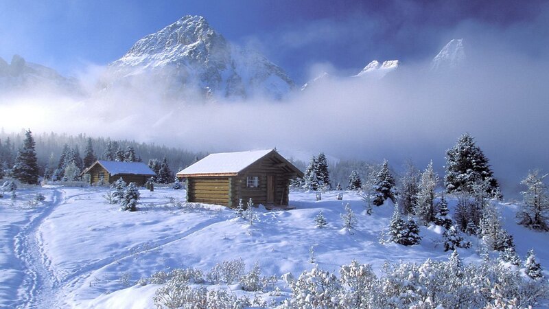 Snowy mountain cabin scene
