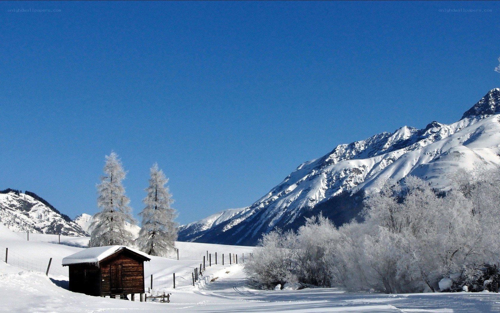 Snowy mountain cabin scene
