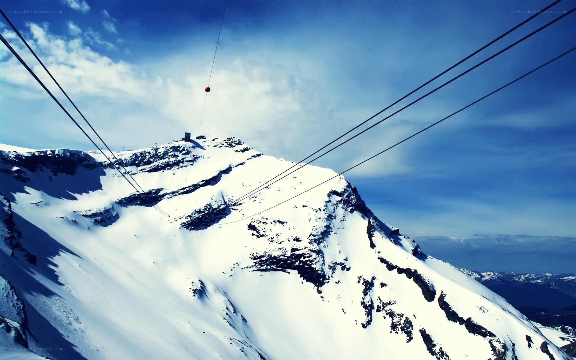 Snowy mountain cable car