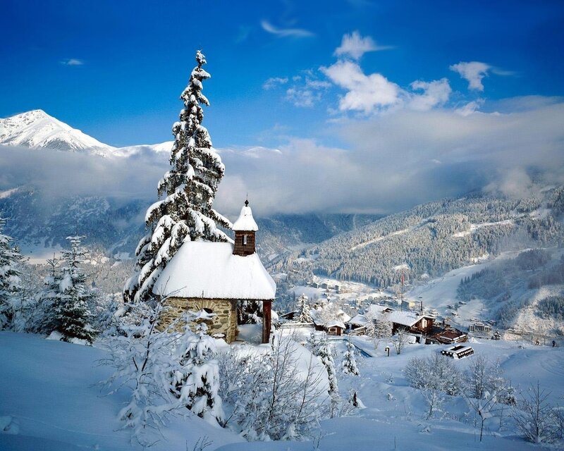 Snowy mountain chapel scene