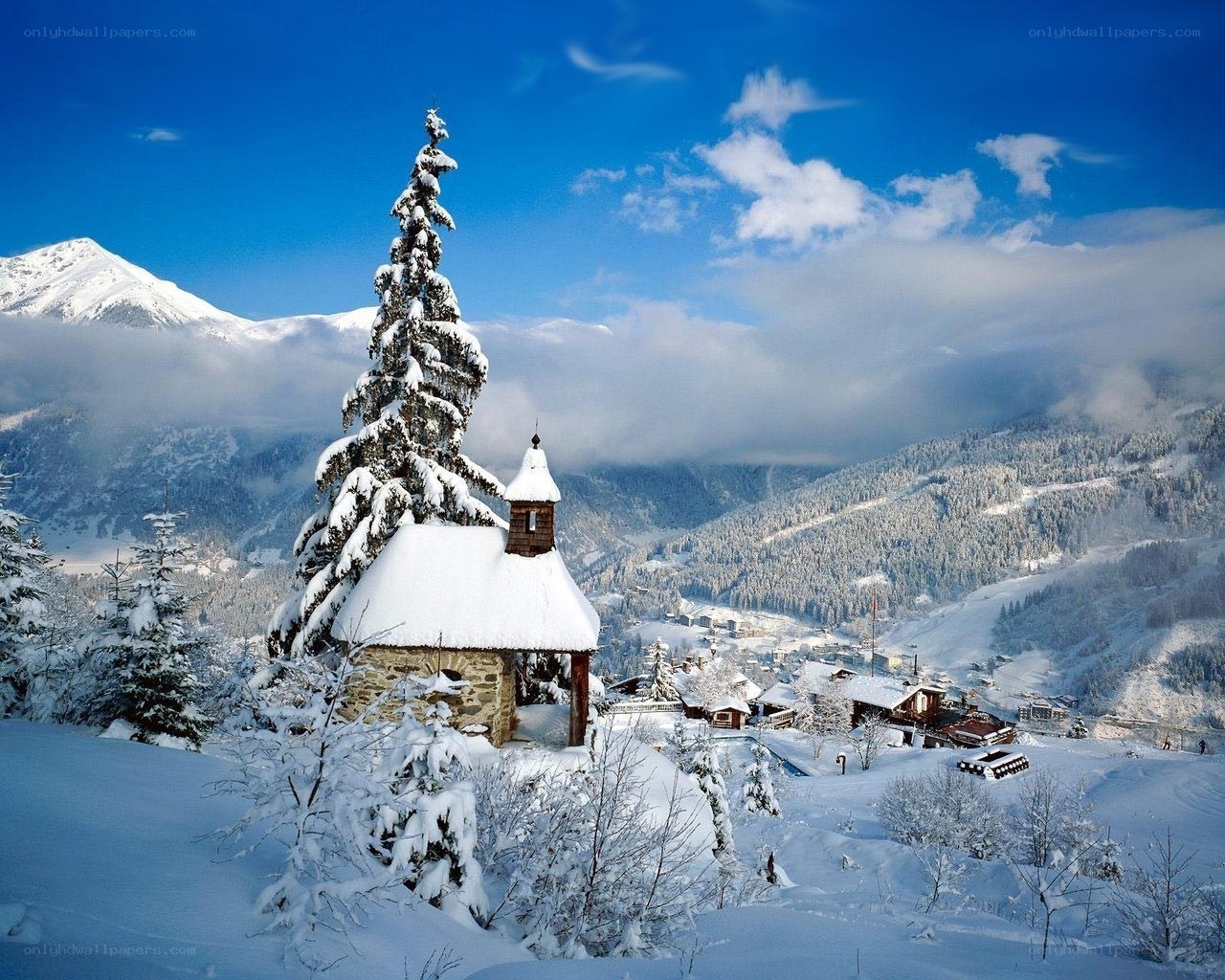 Snowy mountain chapel scene