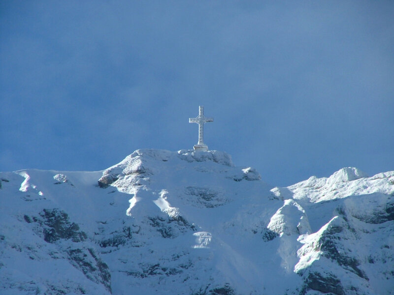 Snowy mountain cross
