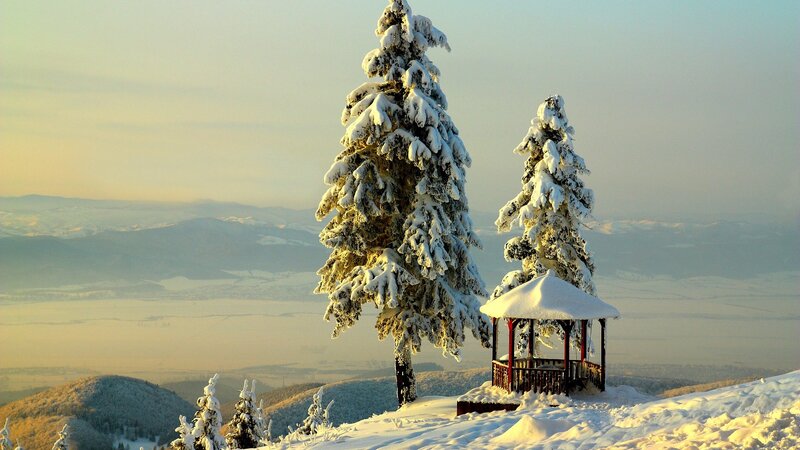 Snowy mountain gazebo at sunrise