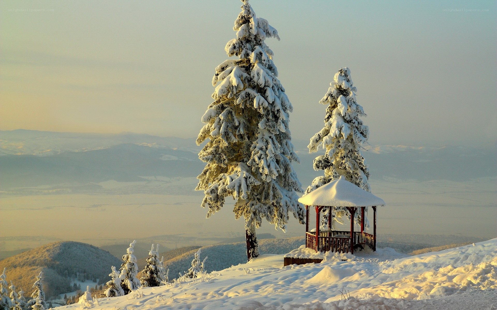 Snowy mountain gazebo at sunrise
