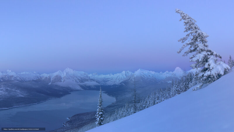 Snowy mountain lake at dawn