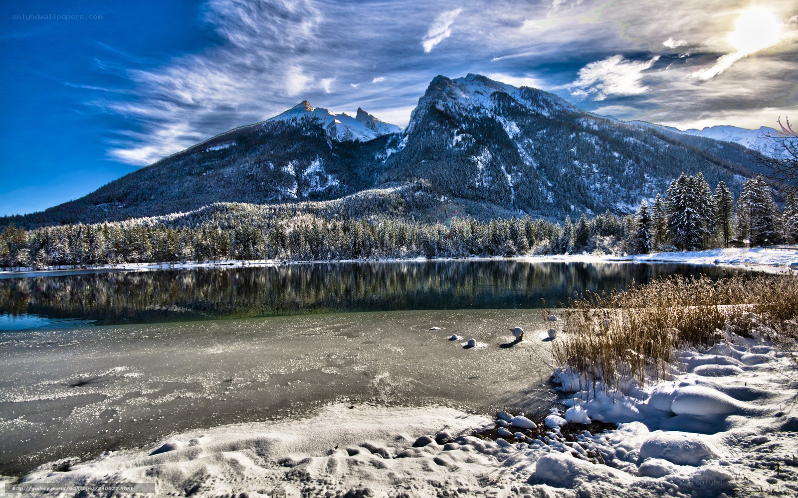 Snowy mountain lake in winter