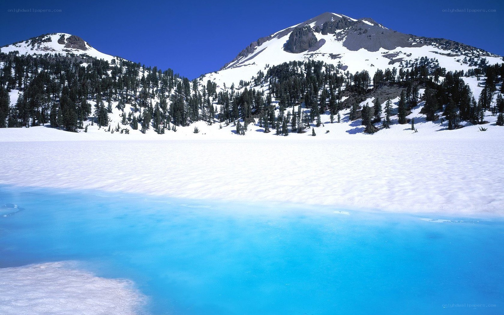 Snowy mountain lake landscape