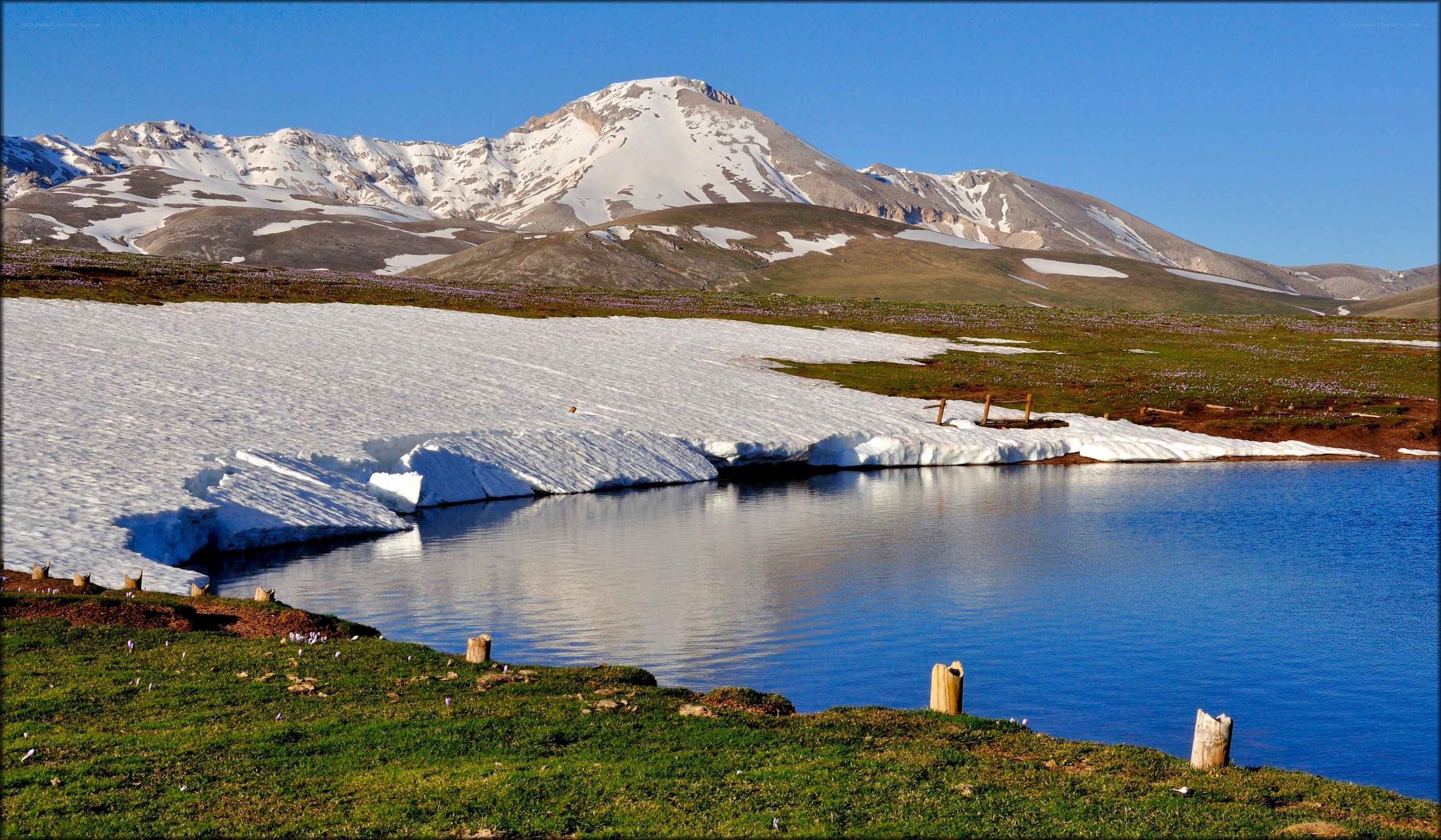 Snowy mountain lake landscape