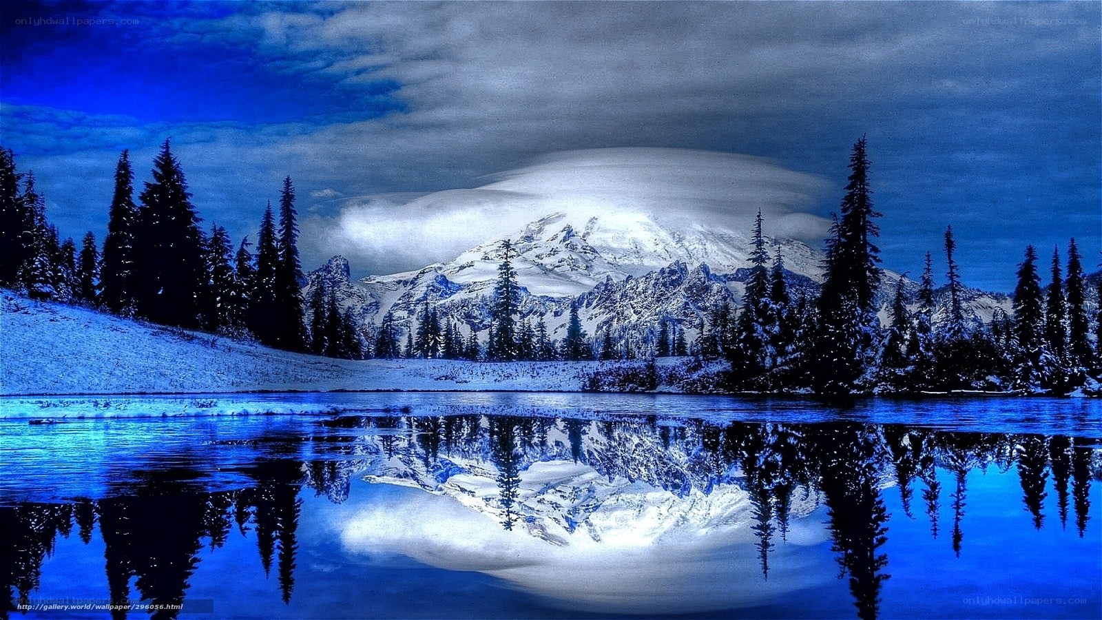 Snowy mountain lake reflection